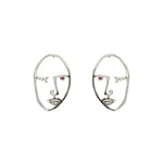 Paola Vilas Brinco Cocteau, um de nossos clássicos, disponível nas variantes Prata 925 ou Prata 925 com banho em Ouro 18k. Ambos com Rubi natural. Joias Femininas.